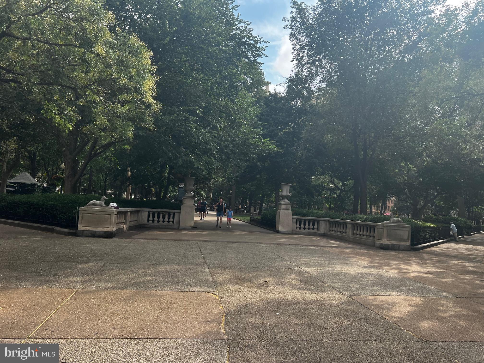 224 West Rittenhouse Square, Unit 1202 Philadelphia, PA 19103 - Photo 16 of 17 a view of a bench and trees in the background