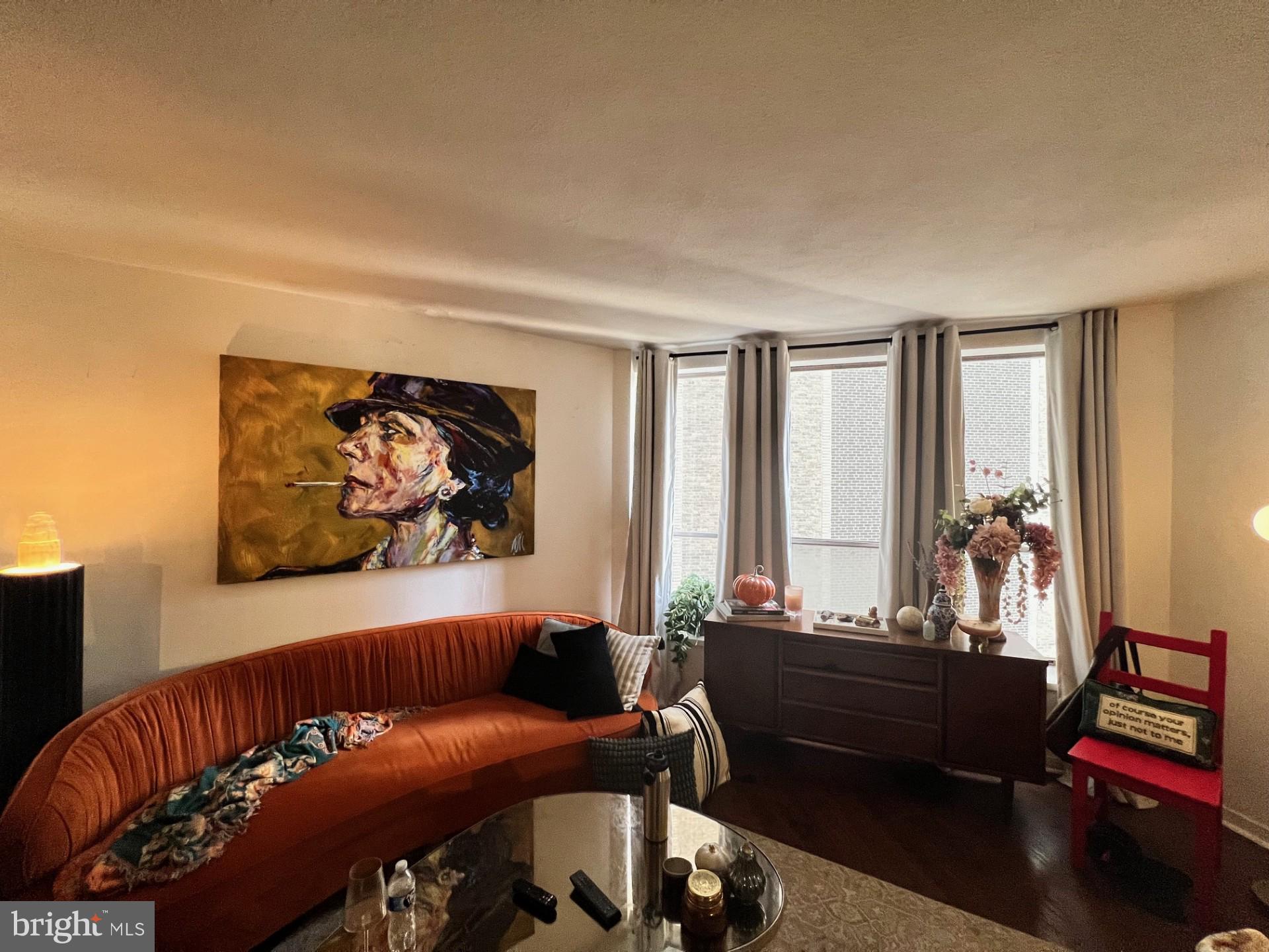 224 West Rittenhouse Square, Unit 1202 Philadelphia, PA 19103 - Photo 8 of 17 a living room with furniture and a potted plant