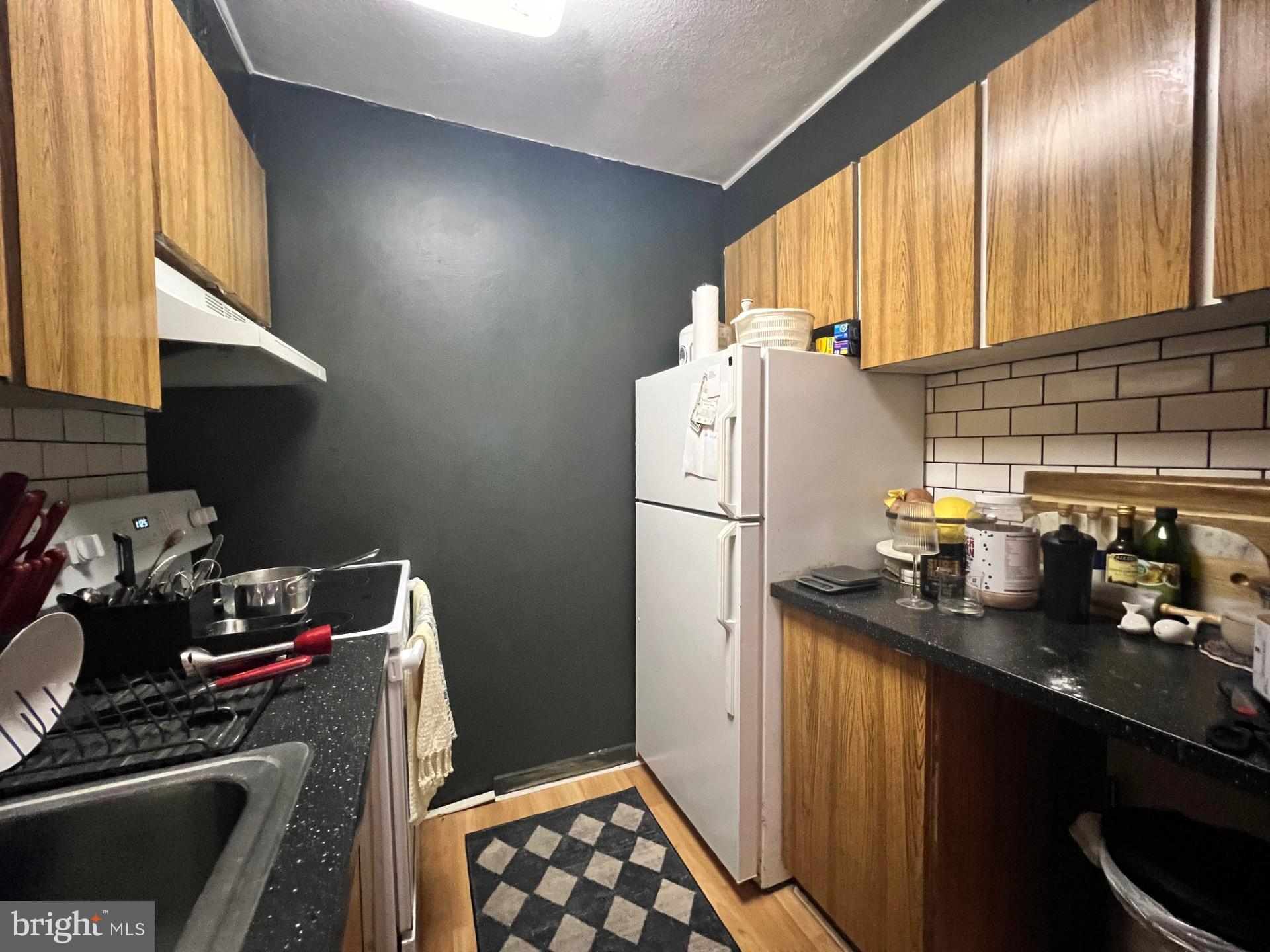 224 West Rittenhouse Square, Unit 1202 Philadelphia, PA 19103 - Photo 10 of 17 a kitchen with refrigerator and window