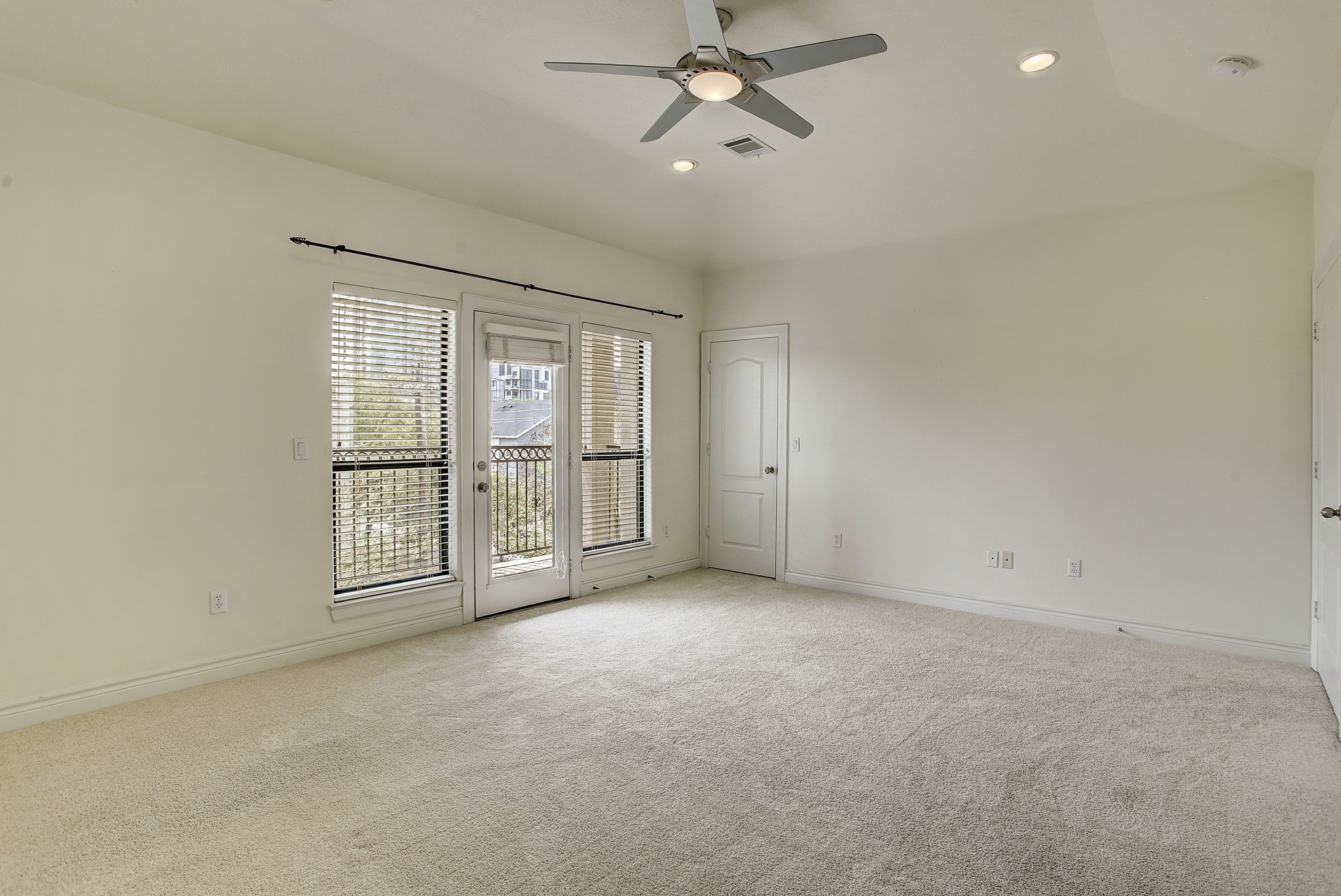1403 Rosedale Street Houston, TX 77004 - Photo 13 of 18 an empty room with chandelier fan and windows