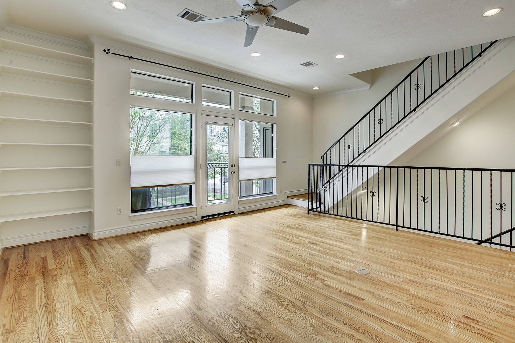 1403 Rosedale Street Houston, TX 77004 - Photo 8 of 18 a view of an empty room with a window and wooden floor