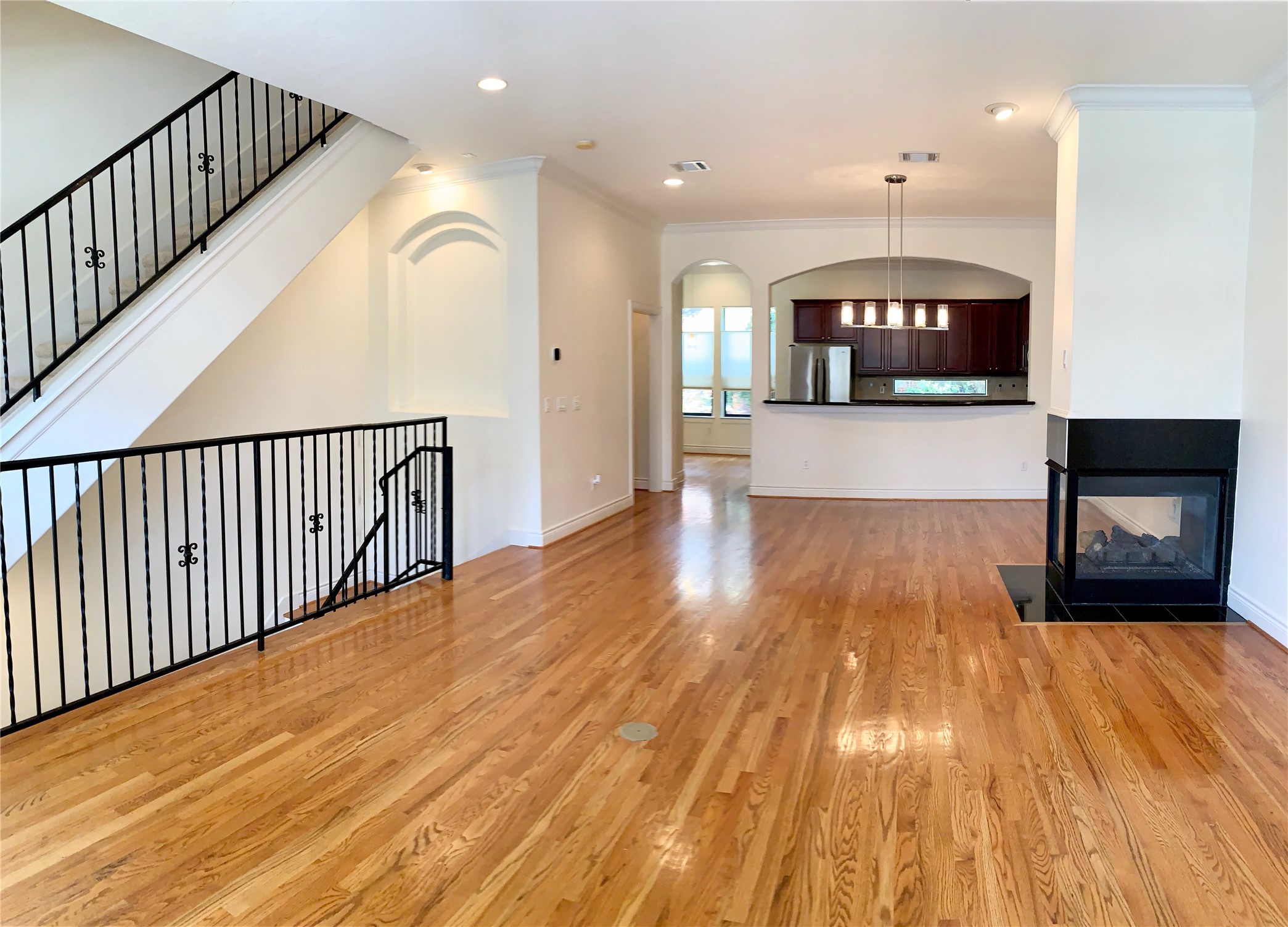 1403 Rosedale Street Houston, TX 77004 - Photo 10 of 18 a view of livingroom with kitchen and a fireplace