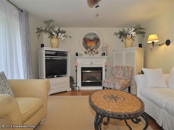 127 Fish Road Tiverton, RI 02878 - Photo 4 of 30 a living room with furniture and a fireplace