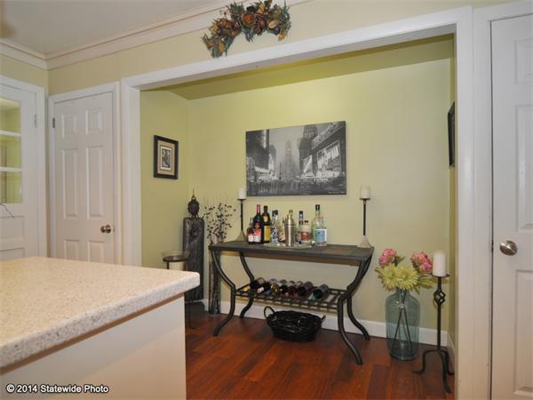 127 Fish Road Tiverton, RI 02878 - Photo 8 of 30 a view of a dining room with furniture and wooden floor