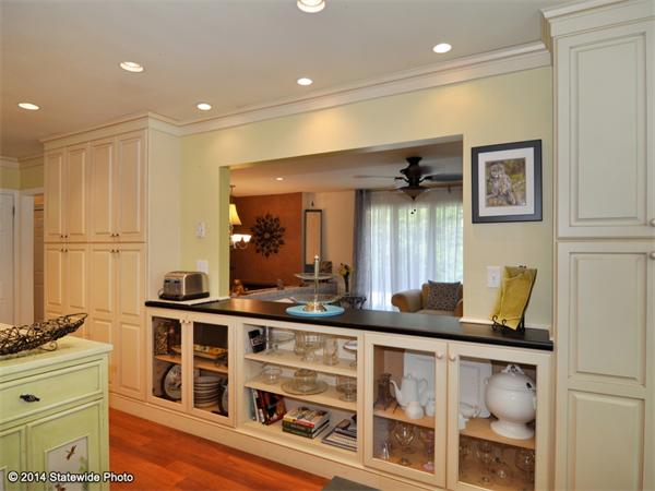 127 Fish Road Tiverton, RI 02878 - Photo 9 of 30 a kitchen with a stove and a refrigerator