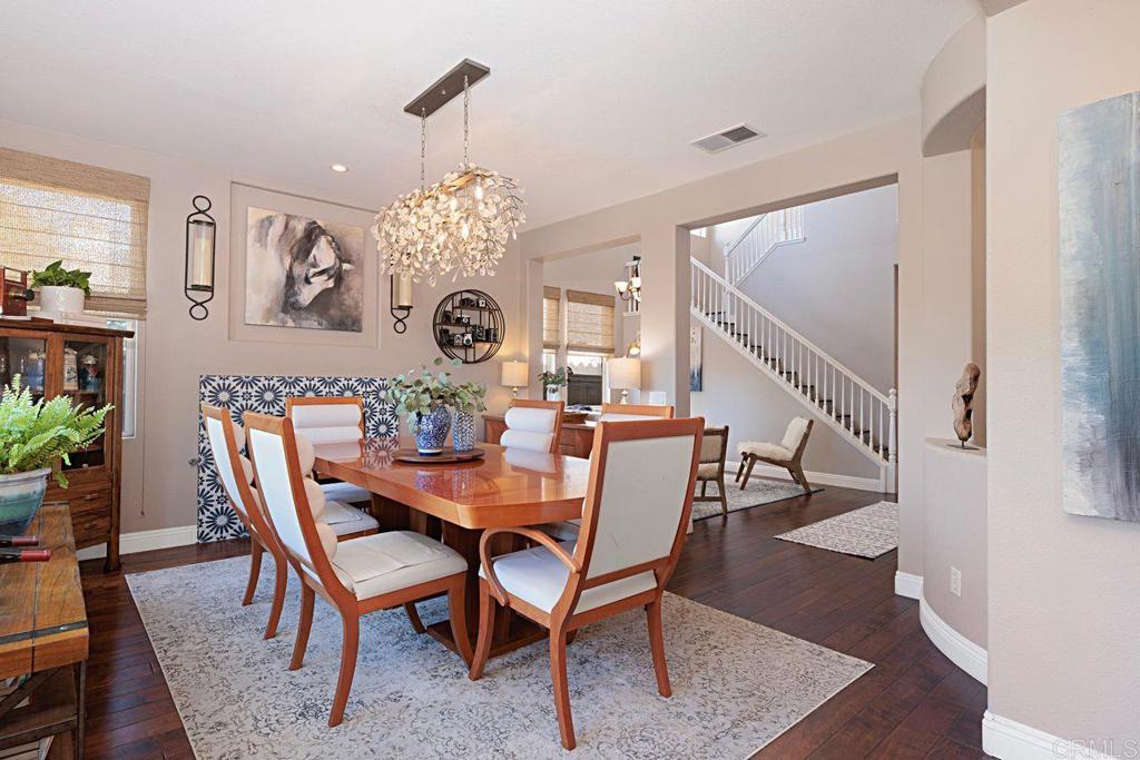 1672 Sagewood Way San Marcos, CA 92078 - Photo 13 of 61 a view of a dining room with furniture and wooden floor