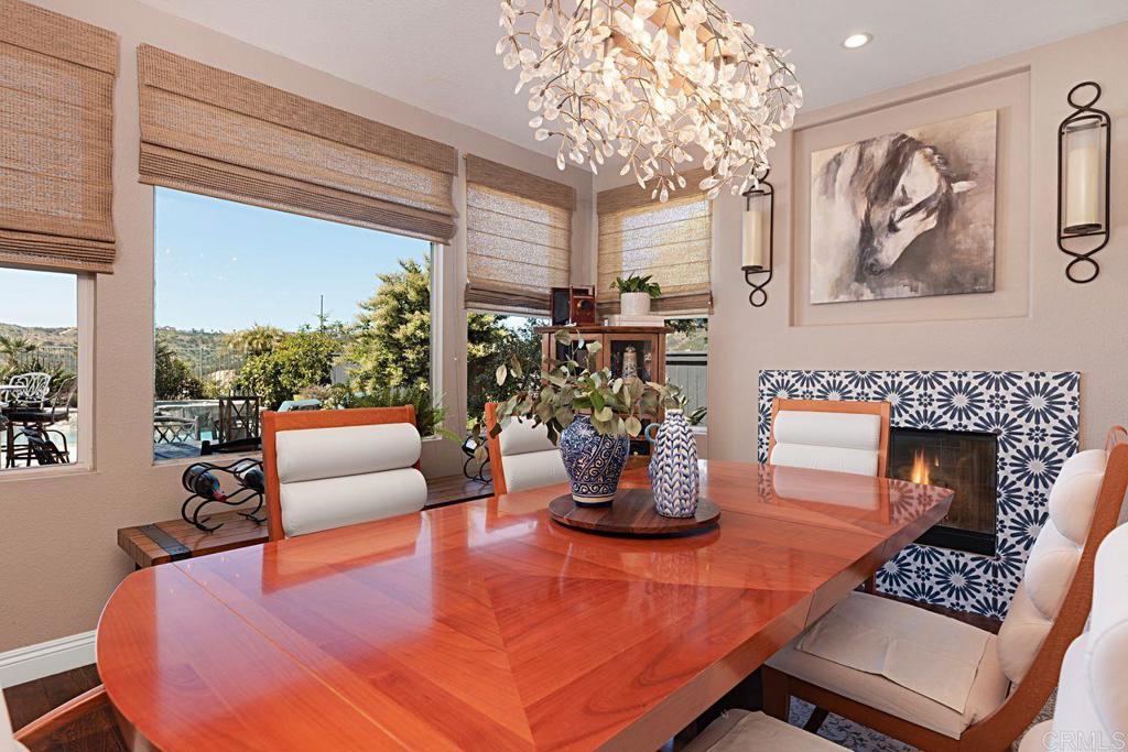 1672 Sagewood Way San Marcos, CA 92078 - Photo 14 of 61 a living room with furniture a fireplace and a potted plant