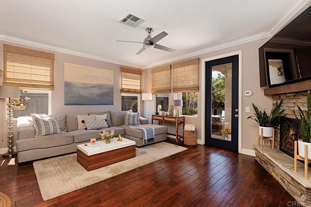 1672 Sagewood Way San Marcos, CA 92078 - Photo 16 of 61 a living room with furniture and a flat screen tv