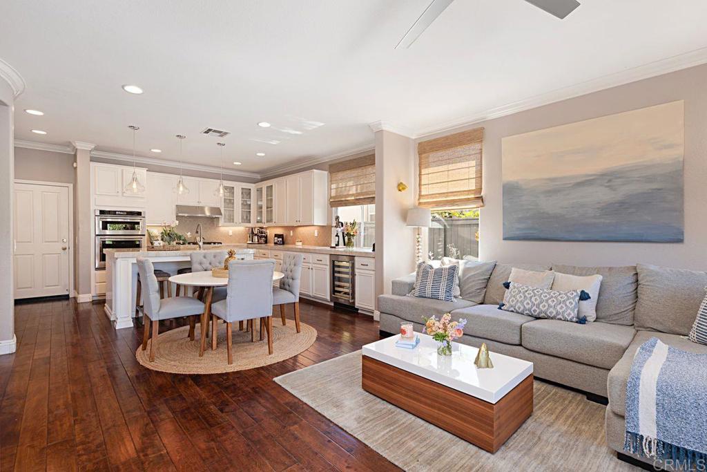 1672 Sagewood Way San Marcos, CA 92078 - Photo 17 of 61 a living room with furniture and kitchen view with wooden floor