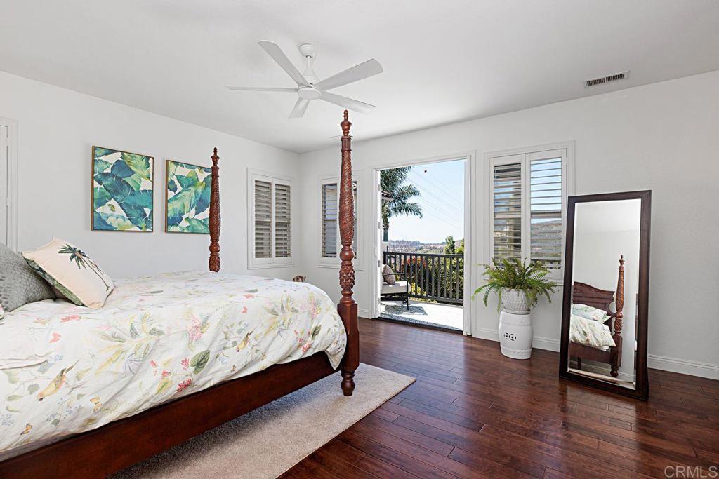 1672 Sagewood Way San Marcos, CA 92078 - Photo 27 of 61 a bedroom with a large bed and a large window