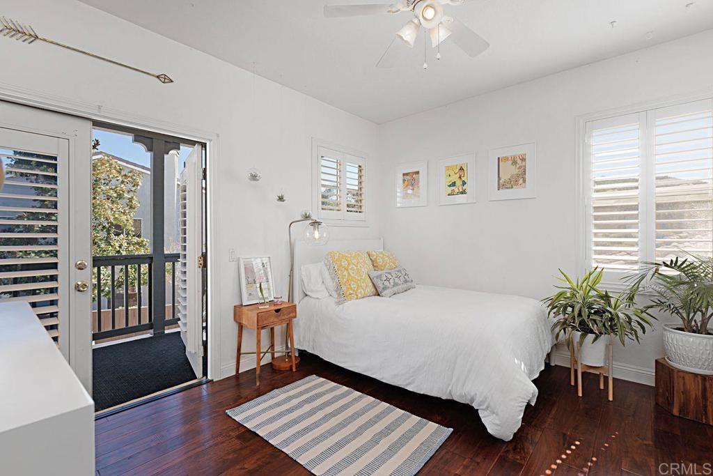 1672 Sagewood Way San Marcos, CA 92078 - Photo 33 of 61 a bedroom with a bed and wooden floor