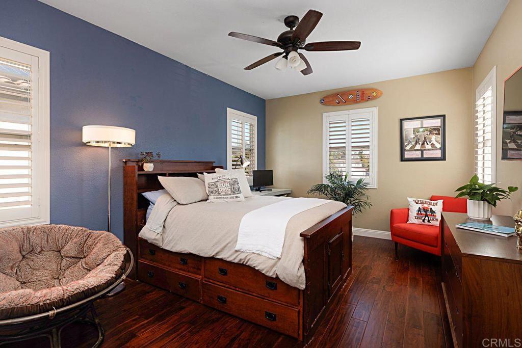 1672 Sagewood Way San Marcos, CA 92078 - Photo 37 of 61 a bedroom with a bed and wooden floor