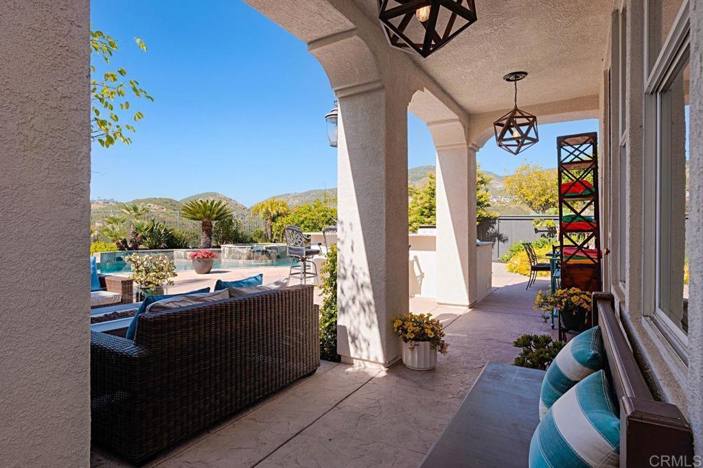 1672 Sagewood Way San Marcos, CA 92078 - Photo 40 of 61 a dining room with furniture and a floor to ceiling window