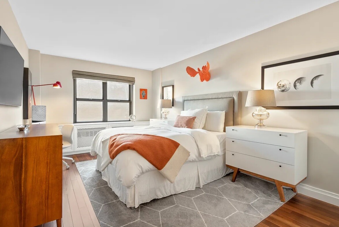 240 East 76th Street, Unit 6V Manhattan, NY 10021 - Photo 3 of 7 a bed room with a bed and a window