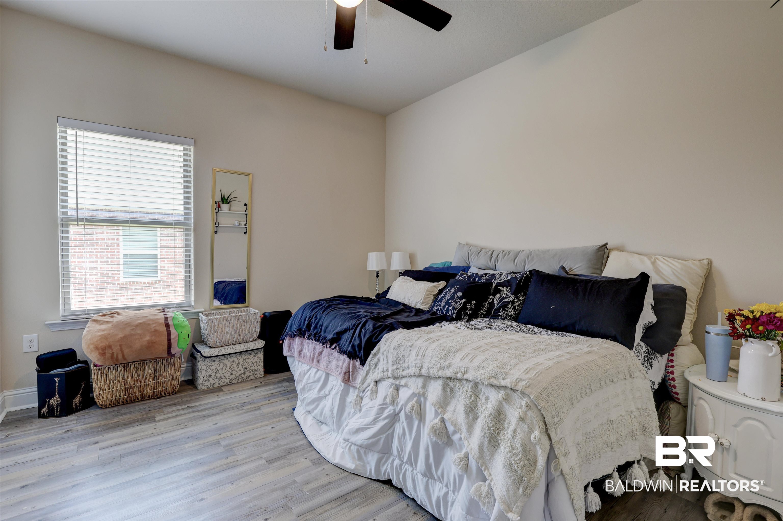 21902 Yosemite Boulevard Fairhope, AL 36532 - Photo 15 of 32 Bedroom featuring ceiling fan and light hardwood / wood-style flooring