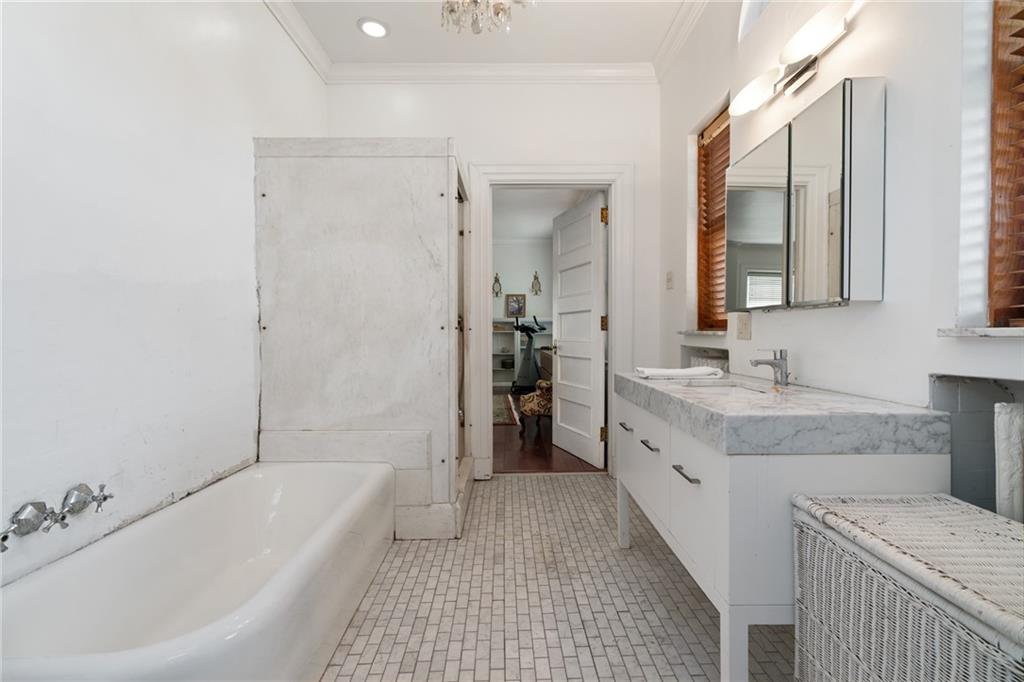 5238 Ellsworth Avenue Pittsburgh, PA 15232 - Photo 20 of 47 a bathroom with a granite countertop sink mirror and a bathtub