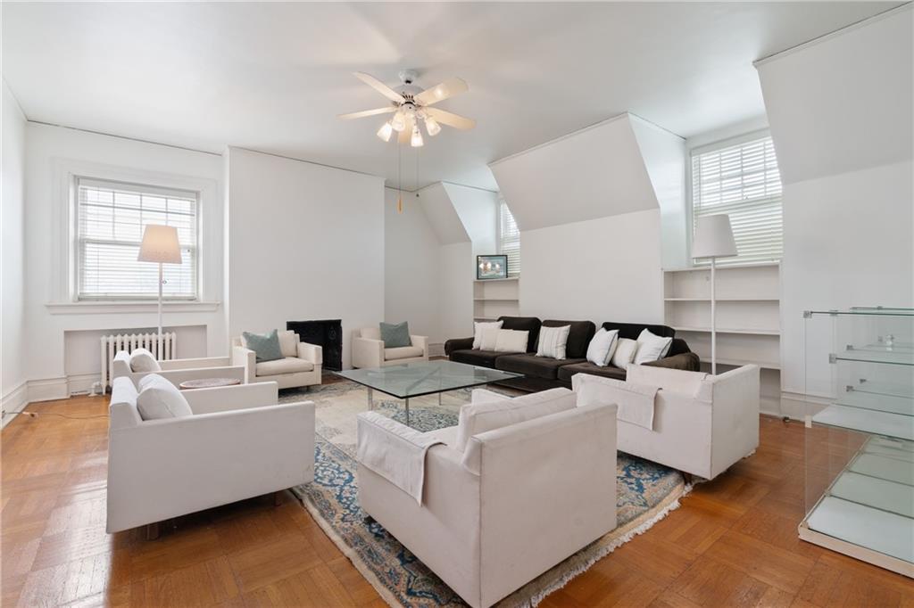 5238 Ellsworth Avenue Pittsburgh, PA 15232 - Photo 29 of 47 a living room with furniture and a chandelier