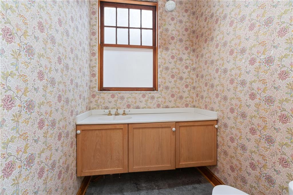 5238 Ellsworth Avenue Pittsburgh, PA 15232 - Photo 31 of 47 a bathroom with a sink and a mirror