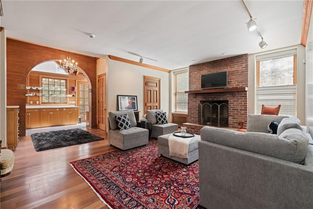 5238 Ellsworth Avenue Pittsburgh, PA 15232 - Photo 6 of 47 a living room with furniture a rug a fireplace and a window
