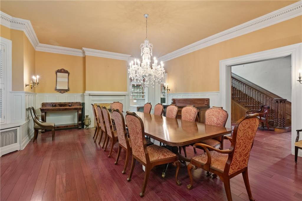 5238 Ellsworth Avenue Pittsburgh, PA 15232 - Photo 7 of 47 a dining room with furniture a chandelier and wooden floor