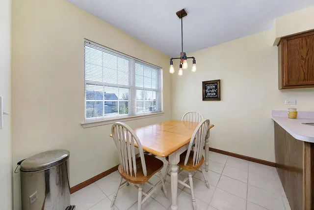 a view of a dining room with furniture and window