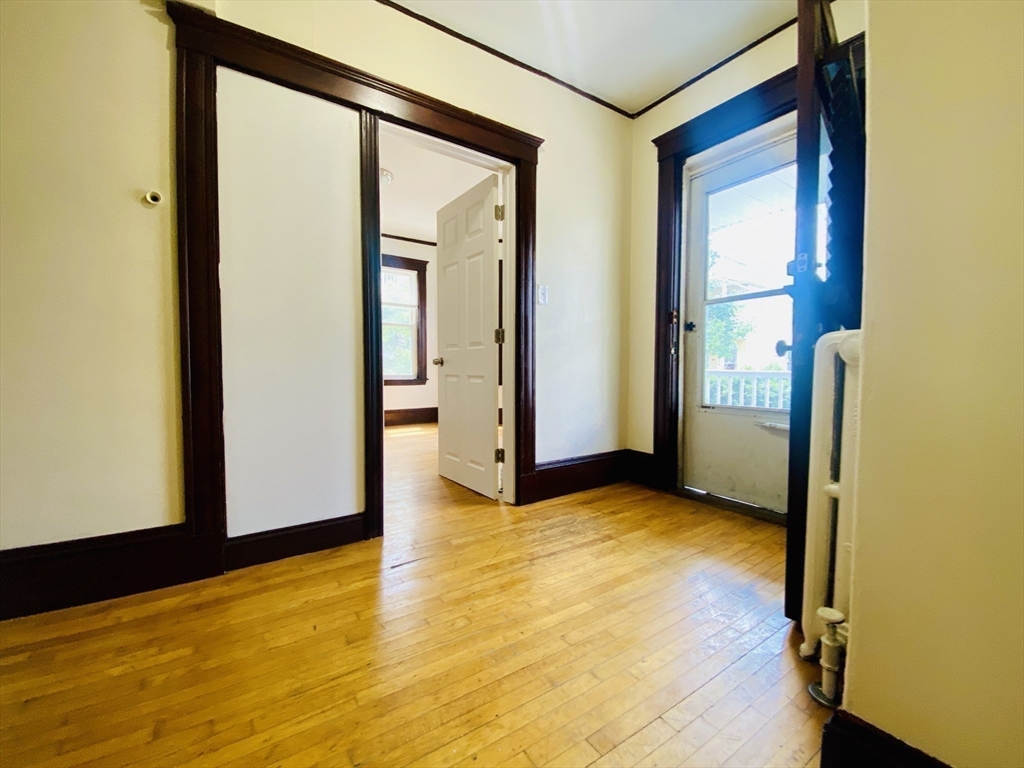39-41 Michigan Avenue, Unit 1 Somerville, MA 02145 - Photo 16 of 27 a view of an empty room with window