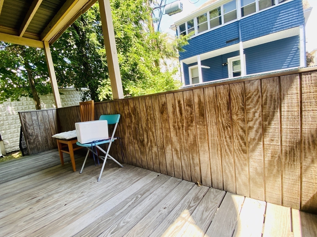 39-41 Michigan Avenue, Unit 1 Somerville, MA 02145 - Photo 20 of 27 a balcony with table and chairs