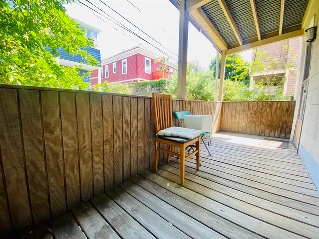 a view of balcony with furniture