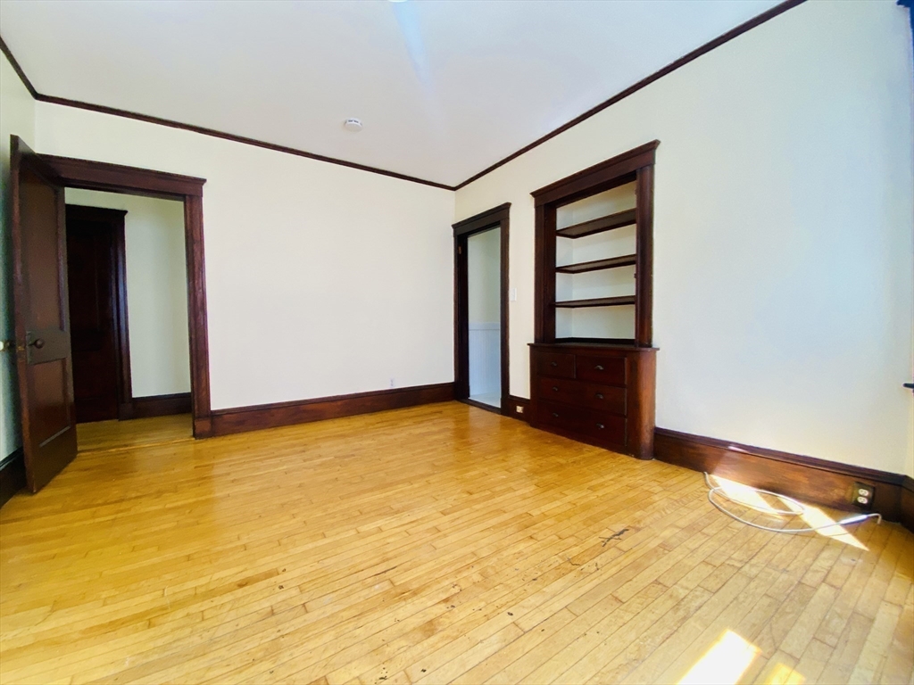 39-41 Michigan Avenue, Unit 1 Somerville, MA 02145 - Photo 23 of 27 a view of an empty room with closet