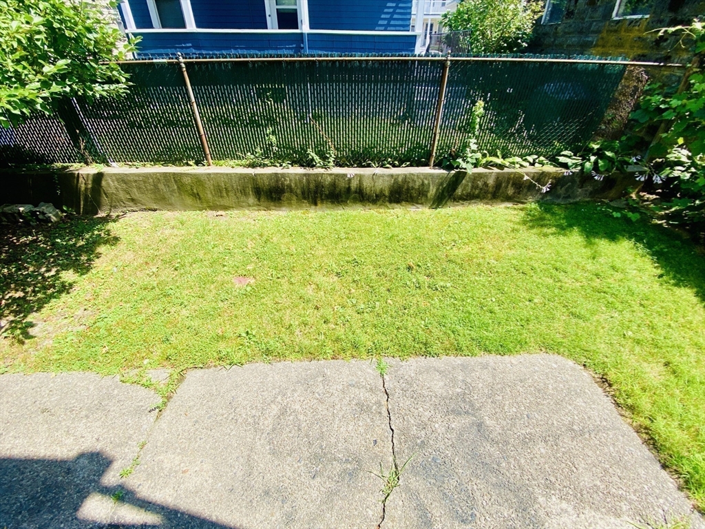 39-41 Michigan Avenue, Unit 1 Somerville, MA 02145 - Photo 25 of 27 a view of a garden with a lounge chair