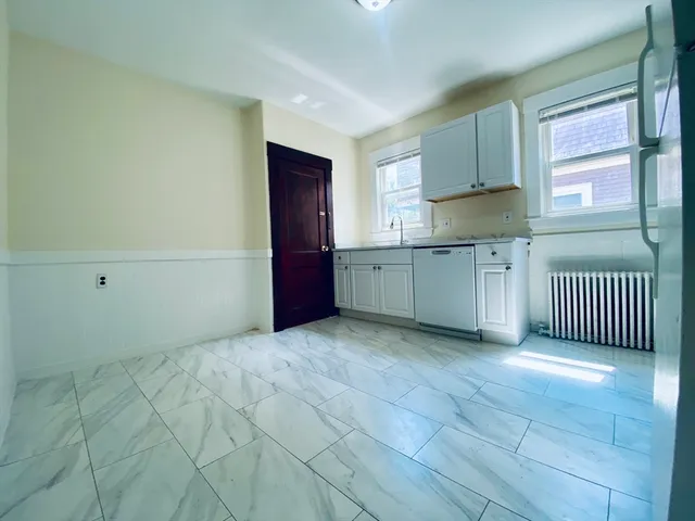 a view of a kitchen with electric appliances