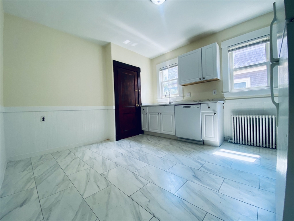 39-41 Michigan Avenue, Unit 1 Somerville, MA 02145 - Photo 3 of 27 a view of a kitchen with electric appliances
