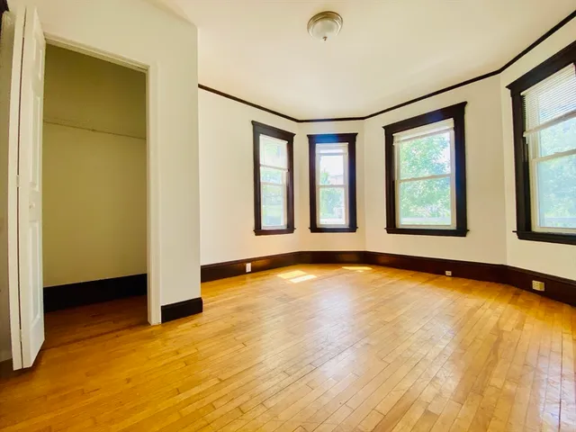 a view of an empty room with glass door