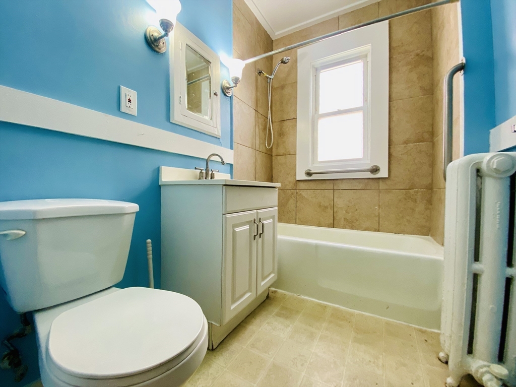 39-41 Michigan Avenue, Unit 1 Somerville, MA 02145 - Photo 10 of 27 a bathroom with a toilet and a bathtub