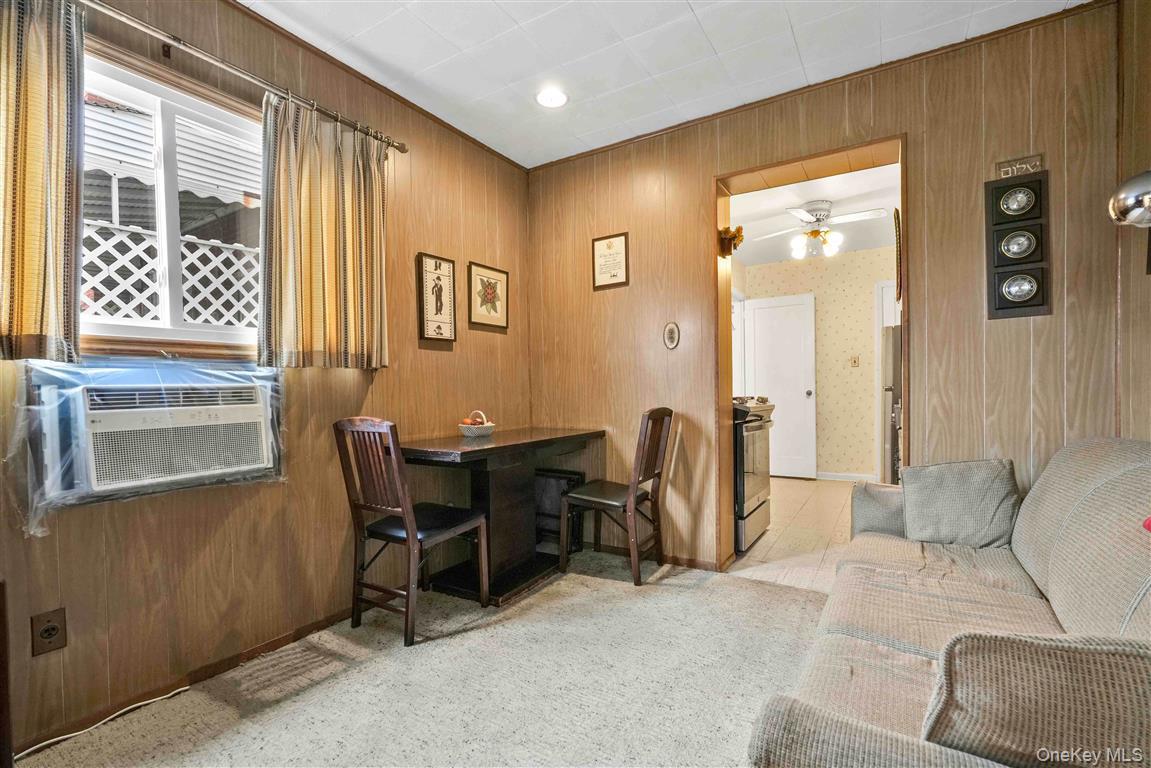 84-92 Austin Street Queens, NY 11415 - Photo 13 of 40 a view of a livingroom with furniture and windows