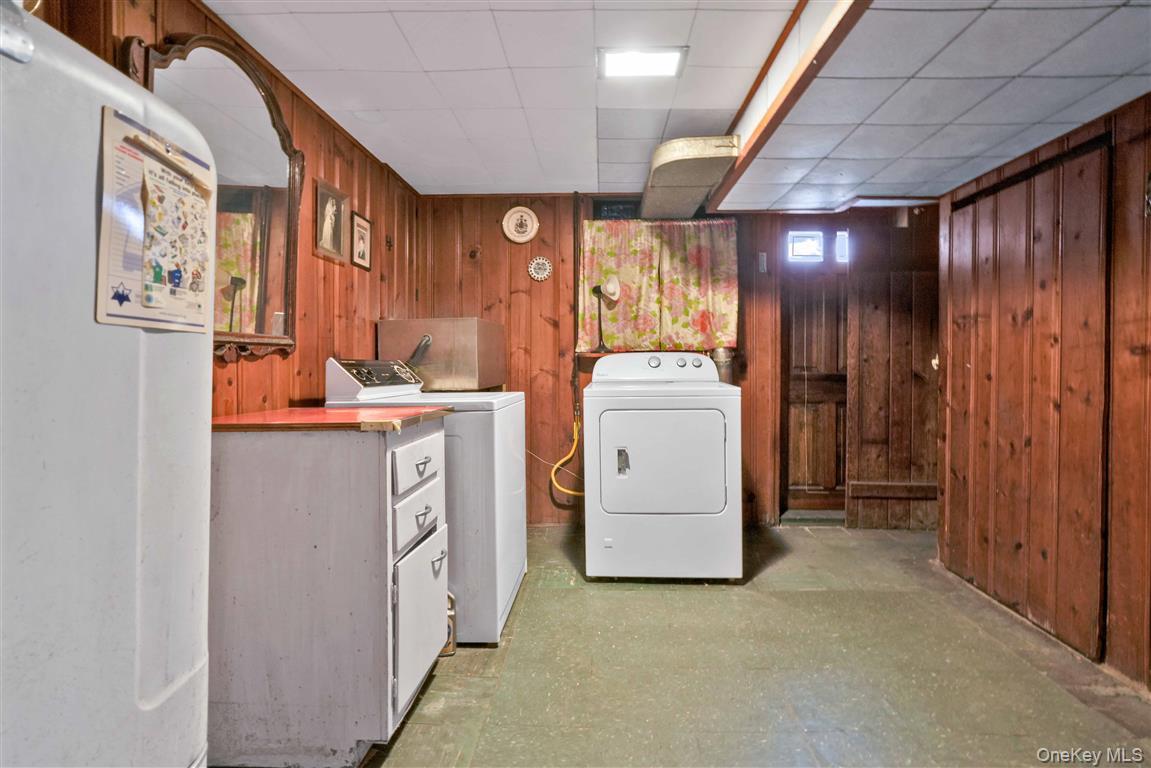 84-92 Austin Street Queens, NY 11415 - Photo 23 of 40 a utility room with dryer and washer