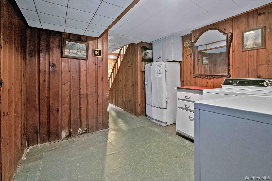 84-92 Austin Street Queens, NY 11415 - Photo 24 of 40 a view of a storage & utility room with washer and dryer