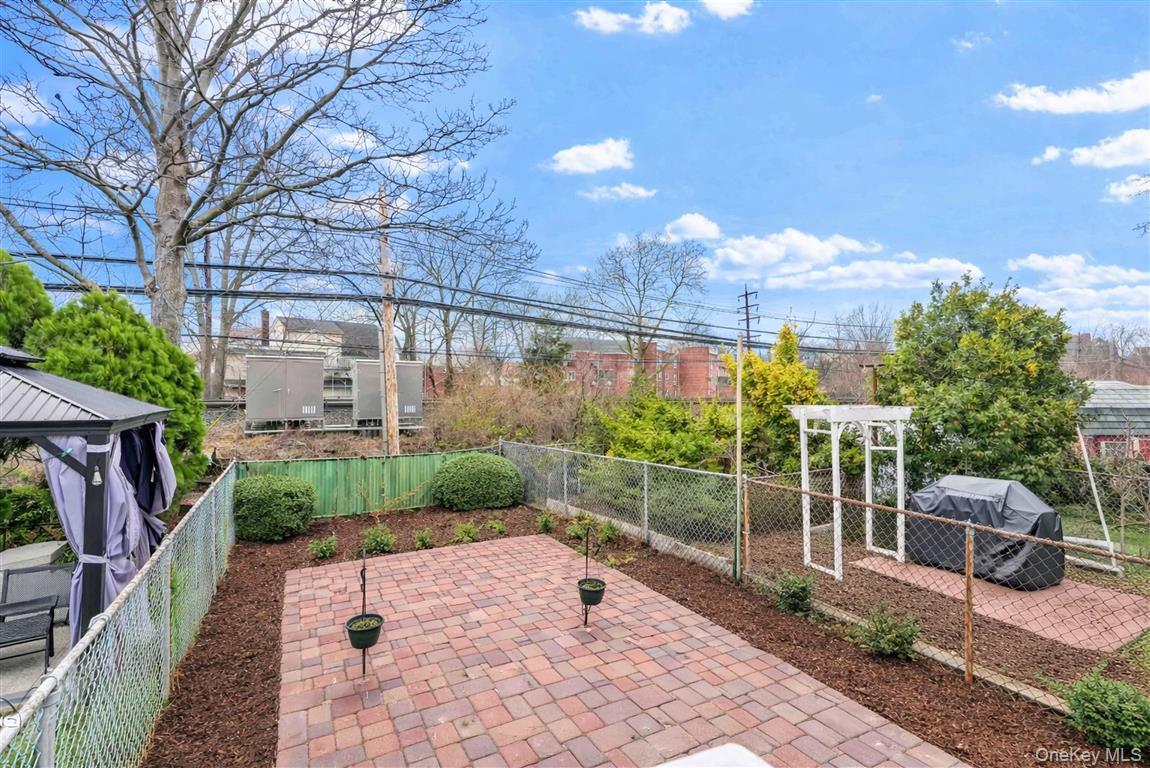 84-92 Austin Street Queens, NY 11415 - Photo 29 of 40 a view of a patio with couches table and chairs and potted plants
