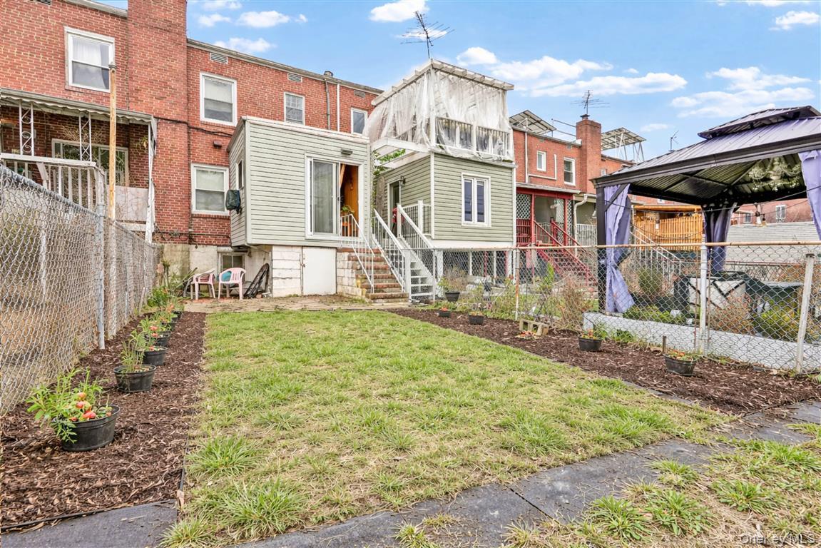 84-92 Austin Street Queens, NY 11415 - Photo 30 of 40 a view of a house with a patio
