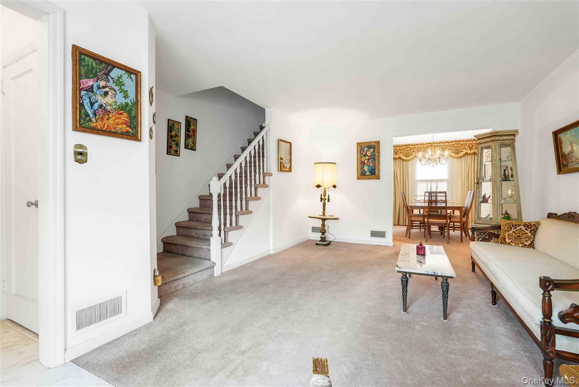 84-92 Austin Street Queens, NY 11415 - Photo 6 of 40 a living room with furniture and a table