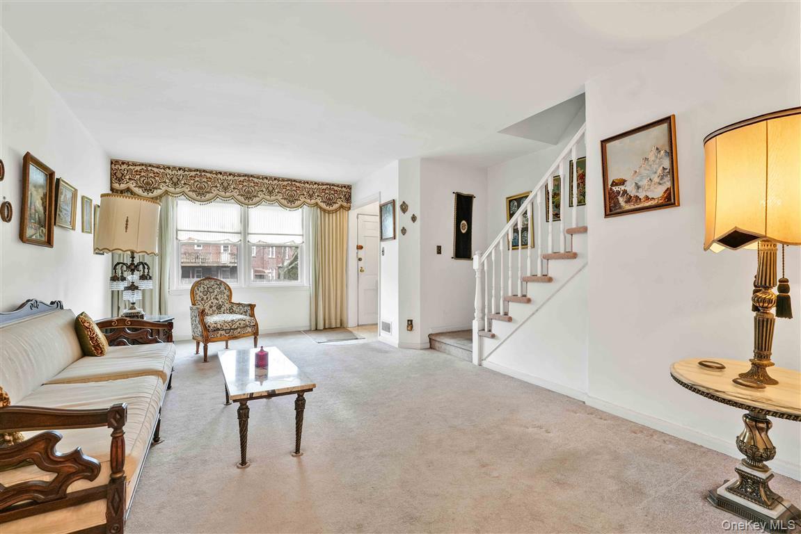 84-92 Austin Street Queens, NY 11415 - Photo 7 of 40 a living room with furniture and a table