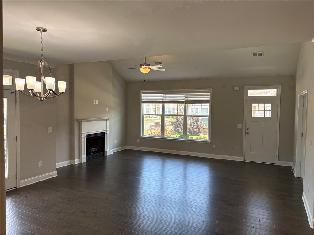 240 Meridian Way Seneca, SC 29672 - Photo 5 of 19 Hardwood floors and a cozy fireplace define this inviting living space.