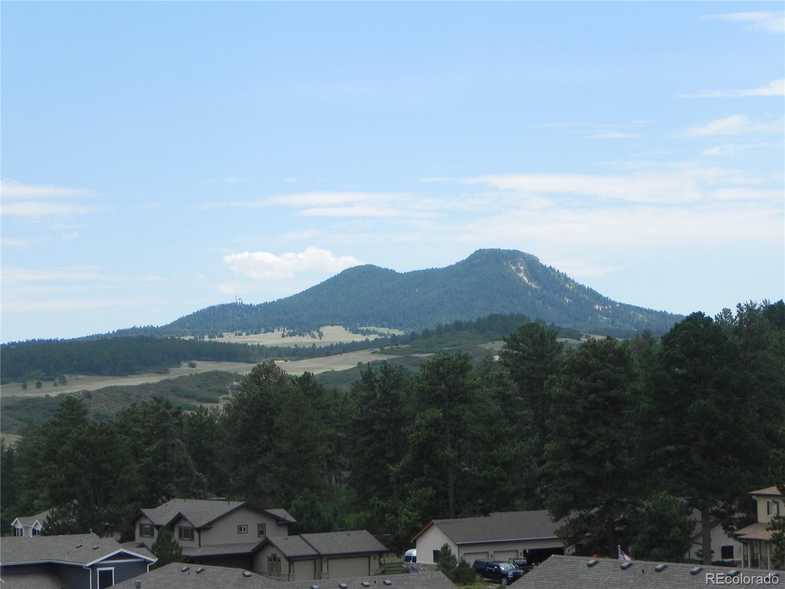 7749 Inca Road Larkspur, CO 80118 - Photo 21 of 49 a view of lake with mountain