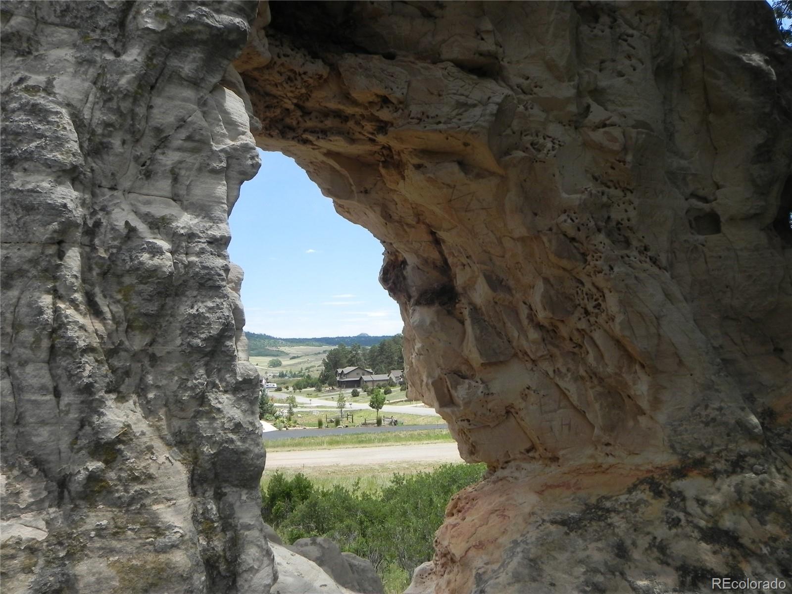 7749 Inca Road Larkspur, CO 80118 - Photo 38 of 49 a view of a yard with trees