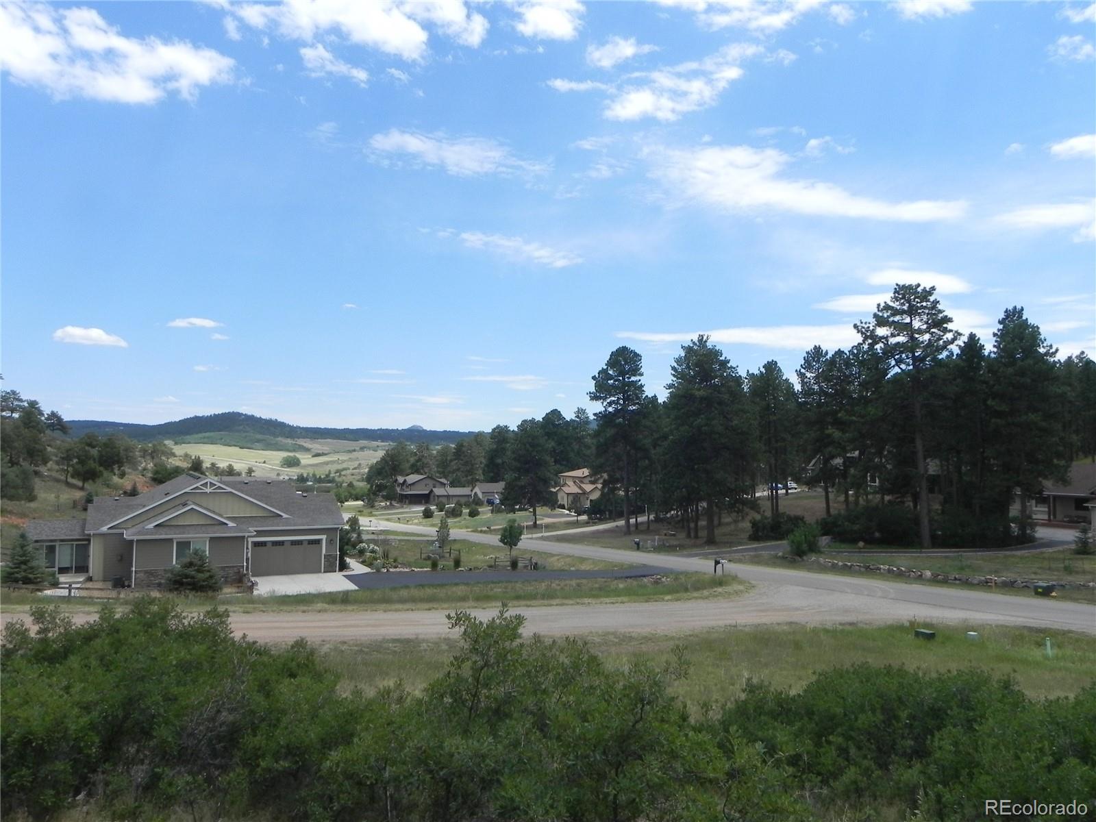 7749 Inca Road Larkspur, CO 80118 - Photo 41 of 49 a view of a town with residential houses