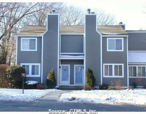 60 Old Town Road, Unit 18 Vernon, CT 06066 - Photo 1 of 1 a view of a house with a yard in the background