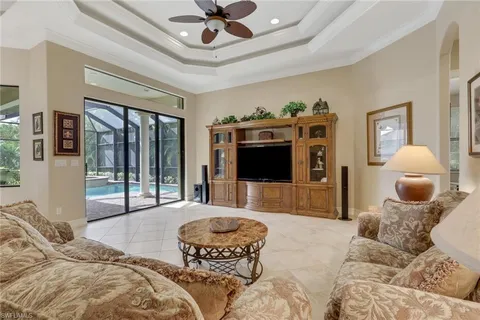 a bedroom with furniture and a flat screen tv