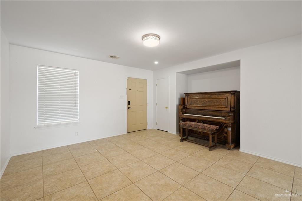 7105 North 40th Street McAllen, TX 78504 - Photo 2 of 13 a view of empty room with furniture and air conditioner vent