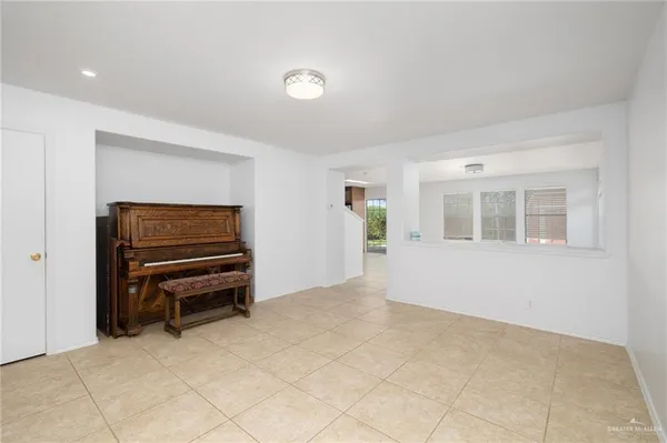 a view of room with furniture and windows