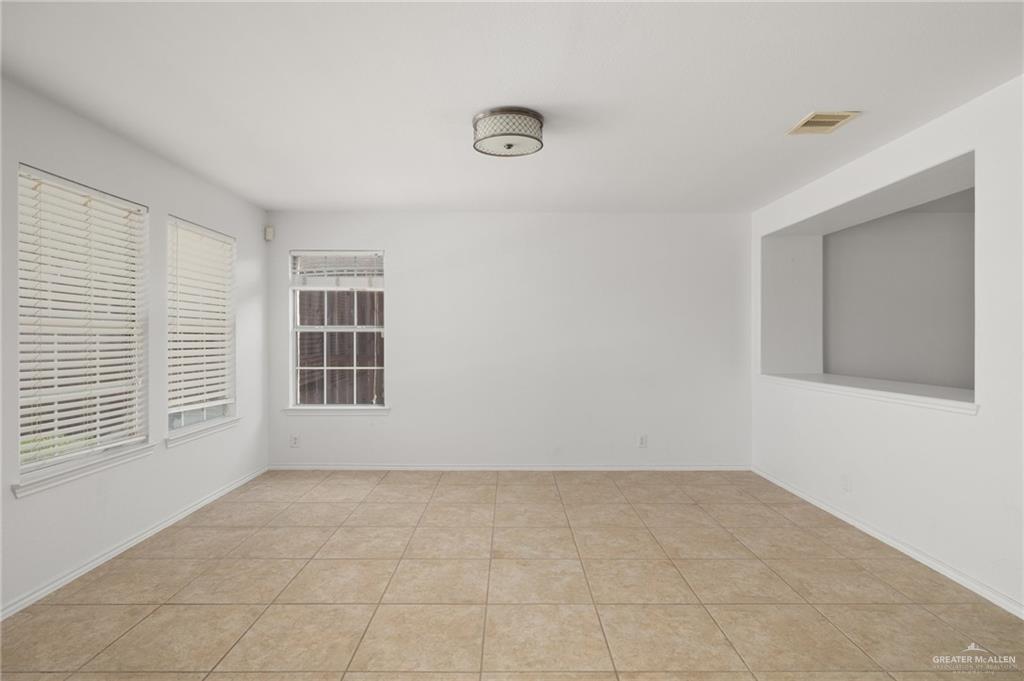 7105 North 40th Street McAllen, TX 78504 - Photo 4 of 13 an empty room with a window